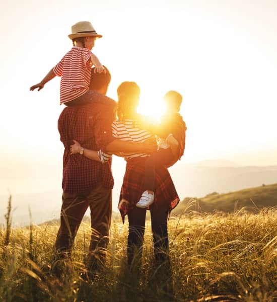 Family standing in a field