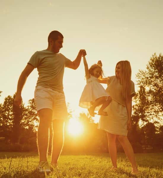 A family walking in a field