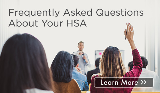 people with their hands raised for a question