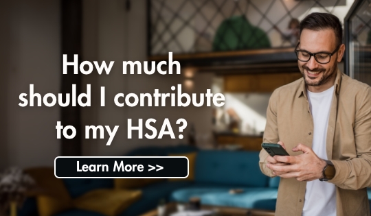 Man smiling at his phone